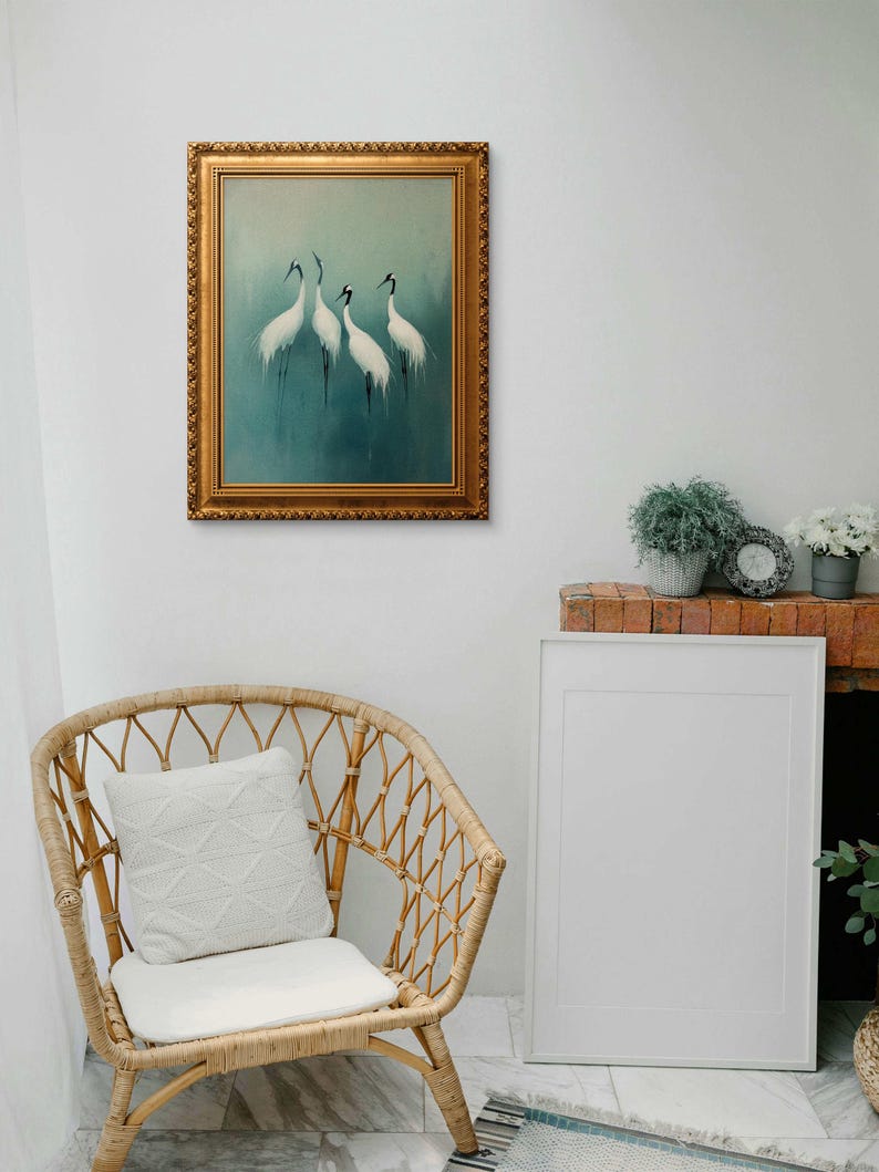 May include: A framed painting of four white cranes standing on a blue and green background. The frame is gold and ornate.