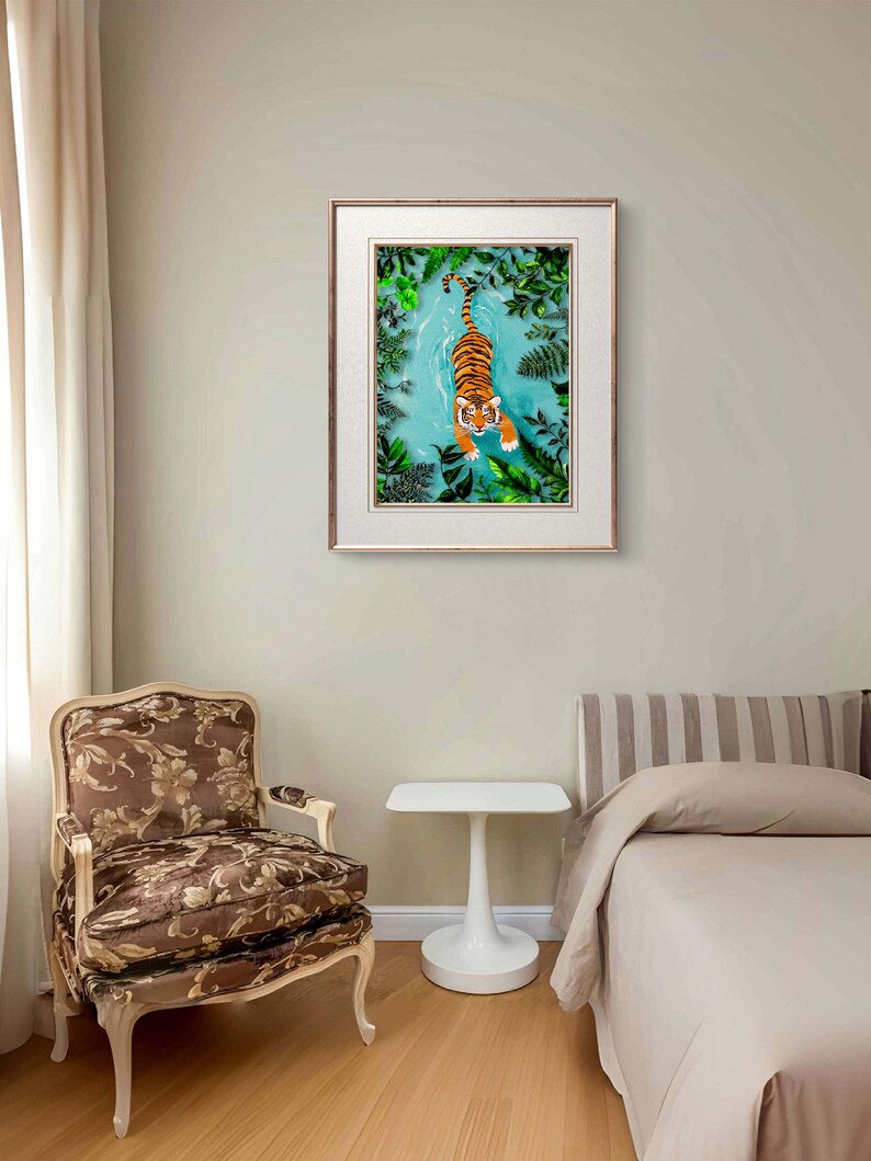 May include: A framed print of a tiger swimming in a turquoise blue pool of water surrounded by green foliage.
