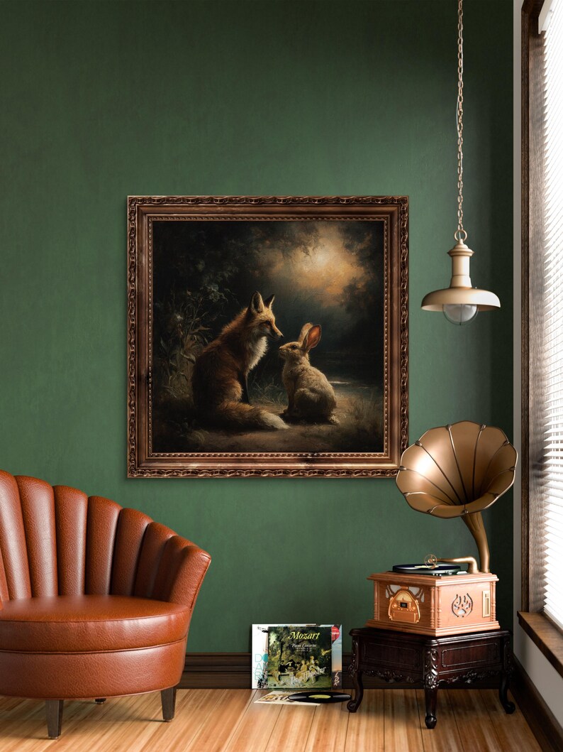 May include: A framed painting depicts a fox and a rabbit in a forest setting. The artwork is in a brown ornate frame, hanging on a dark green wall. A vintage gramophone and a brown leather armchair are also in the room.
