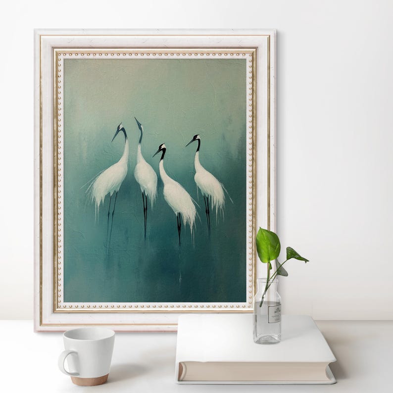 May include: A framed painting of four white cranes with black heads and beaks standing on a teal blue background.