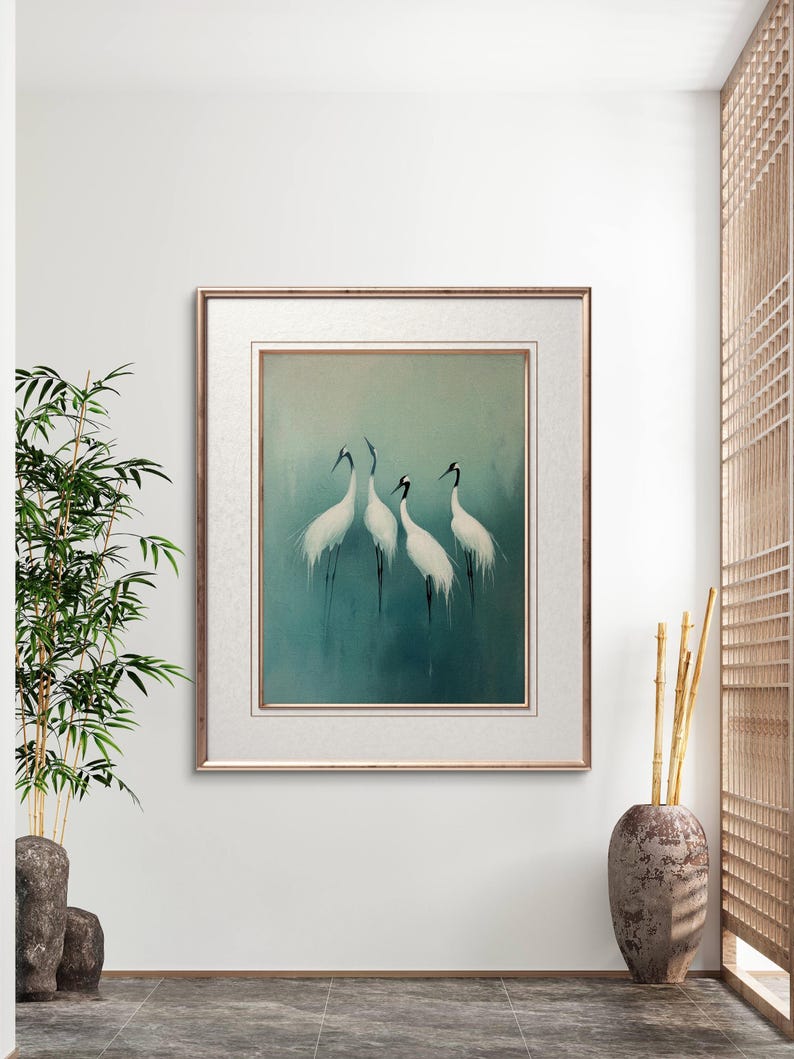 May include: Framed painting of four white cranes standing in a blue-green water setting. The cranes are facing different directions and have black legs and beaks.