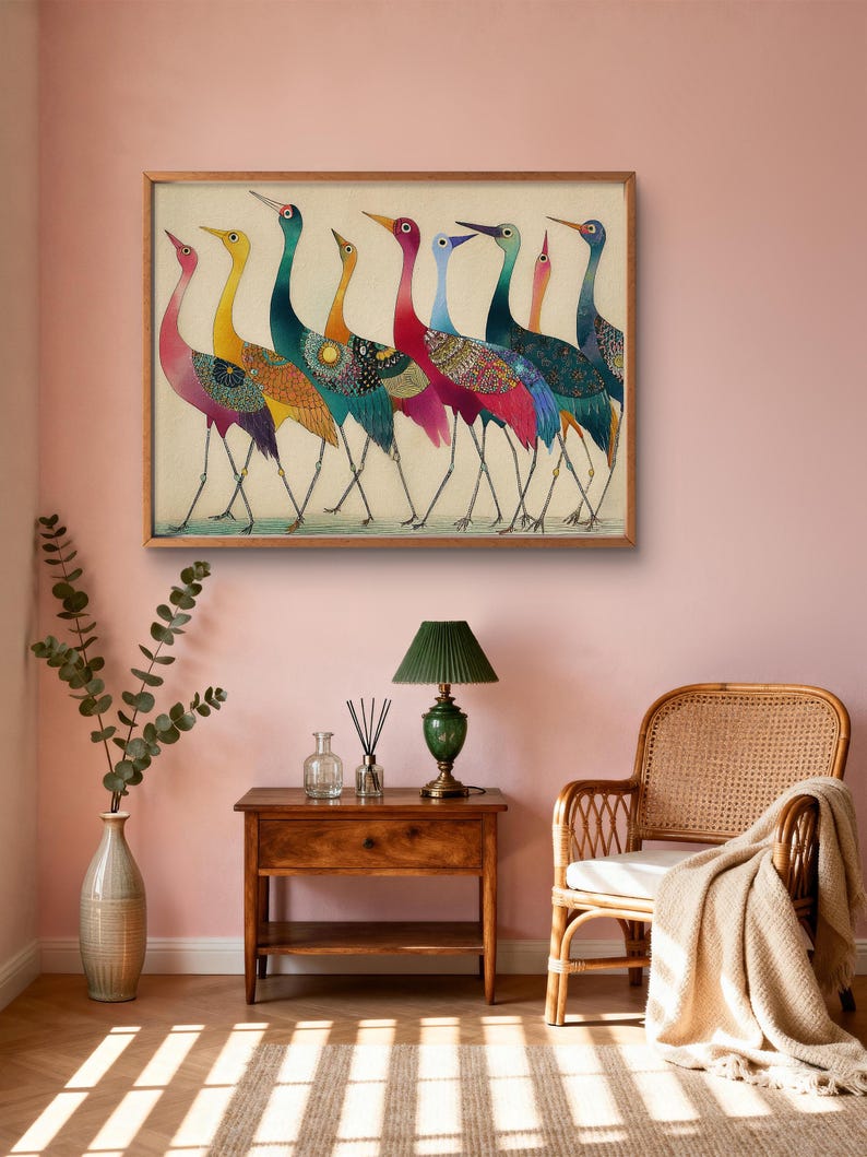 May include: A framed artwork featuring a line of colorful birds with long necks and legs. The birds have a variety of colors, including pink, yellow, teal, and red. The artwork is displayed on a pink wall.