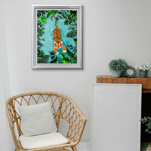 May include: A framed illustration of a tiger swimming in a blue body of water surrounded by green foliage.