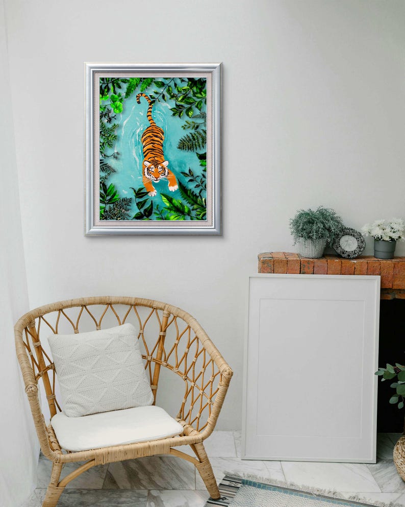 May include: A framed illustration of a tiger swimming in a blue body of water surrounded by green foliage.