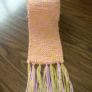 pink and yellow knitted child scarf