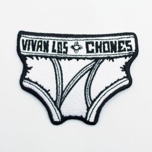 May include: White embroidered patch with black stitching depicting a pair of underwear with the text "Vivan Los Chones" across the waistband.