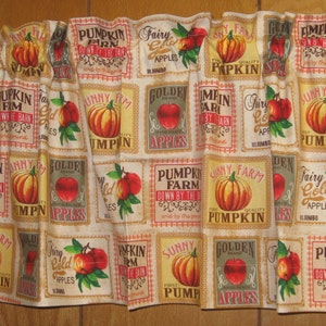 May include: Cream-colored valance with a repeating pattern of vintage-style labels featuring pumpkins and apples. The labels include text such as "Pumpkin Farm" and "Golden Apples."