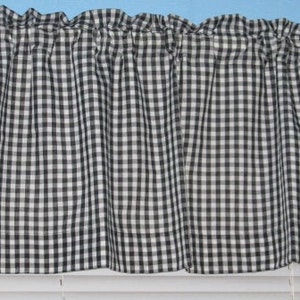 May include: Black and white gingham valance with a ruffled top edge. The valance is made of a lightweight fabric and has a simple, classic design.