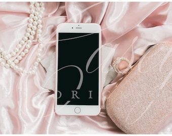 Download Free Glitz and glam silky pink mockup of iphone with rose gold purse and pearls PSD Template