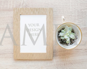 Download Free Rose gold blank frame simple mockup with teacup and succulent on wood stock photo - vertical PSD Template
