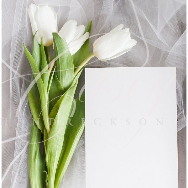 Blank wedding invitation 5x7 card stock photo mockup with white tulips and veil