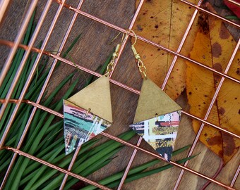 May include: A pair of gold and patterned triangle earrings. The earrings are made of two triangles, one gold and one with a colorful geometric pattern.