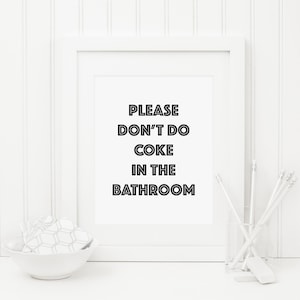 May include: White framed sign with black text that reads "PLEASE DON'T DO COKE IN THE BATHROOM".