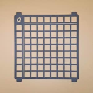 May include: A blue grid-patterned object with a square shape and a logo in the upper left corner. The grid is composed of numerous small squares, and the object has tabs on each corner. The object is set against a neutral background.