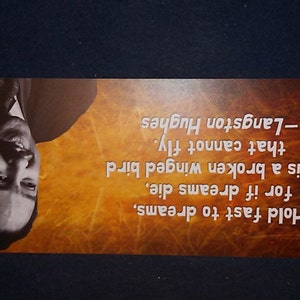 May include: A motivational quote by Langston Hughes on a brown background with a black and white photo of him. The quote reads: "Hold fast to dreams, for if dreams die, life is a broken winged bird that cannot fly. -Langston Hughes"