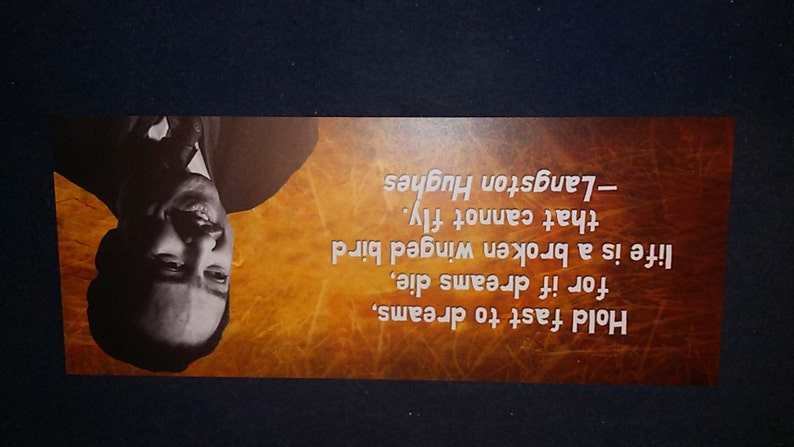 May include: A motivational quote by Langston Hughes on a brown background with a black and white photo of him. The quote reads: "Hold fast to dreams, for if dreams die, life is a broken winged bird that cannot fly. -Langston Hughes"