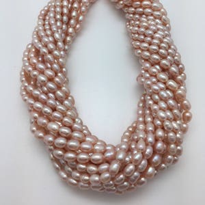 Lustrous Peach 4 - 5mm Rice Freshwater Pearls Strand 15&quot;
