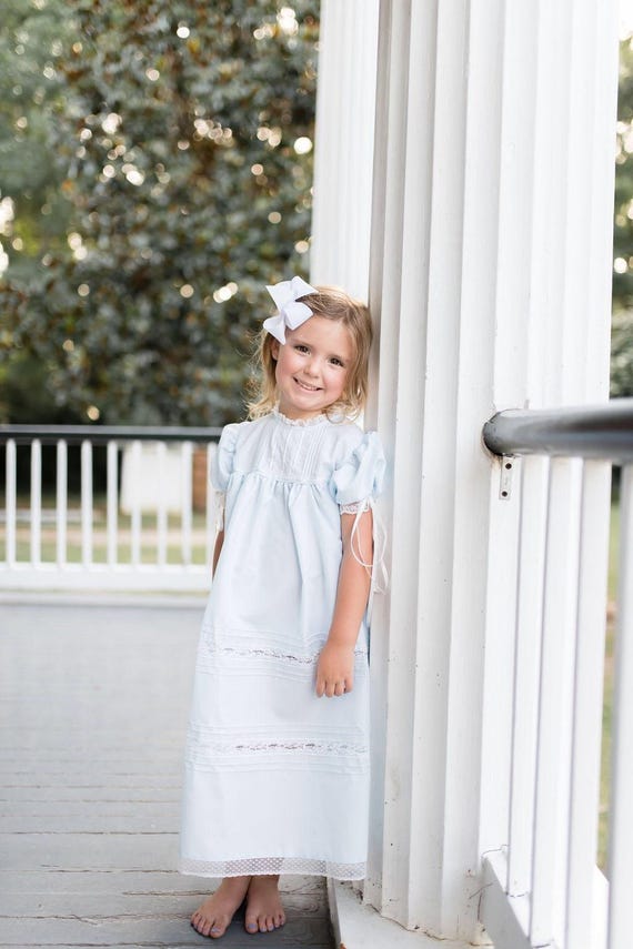 princess polly baby blue dress A close up of a navy blue dress with beaded embroidery