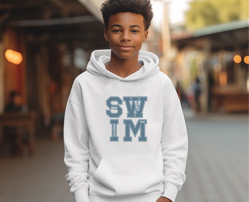 May include: White hoodie with a front pocket and the word "SWIM" in a blue collegiate font. The words "BACK", "BREAST", and "FLY" are above and below "SWIM". The word "FREESTYLE" is below "IM".