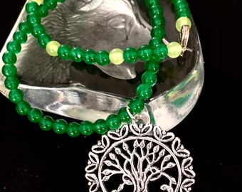 A Green Jade Beaded Necklace with a Tree of Life Pendant