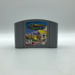 May include: A grey Nintendo 64 game cartridge with a colourful label featuring the text "Cruisin' World" and an ESRB rating of "Everyone".