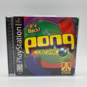 May include: A PlayStation game case with a colorful design featuring the words "It's Back!" and "Pong The Next Level" in yellow letters. The case is for the game Pong, which is a classic arcade game. The case is black with a clear plastic cover. The game is rated E for Everyone by the ESRB.