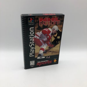 May include: A PlayStation game box for NHL Face-Off. The box features a photo of two hockey players in action, one in a red and white jersey and the other in a black and gold jersey. The game is rated "K-A" for Kids to Adults by the ESRB.