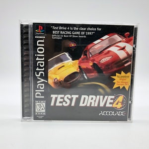 May include: PlayStation game case for Test Drive 4, a racing game. The case is black with a red and yellow car on the front. The text "Test Drive 4" is in white and the text "Acclaim" is in white on a red background.