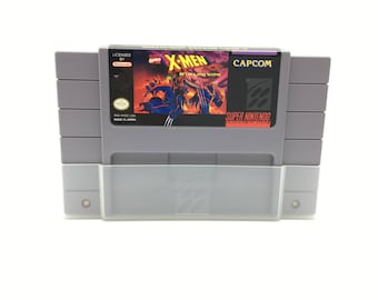 May include: A Super Nintendo Entertainment System game cartridge for X-Men: Mutant Apocalypse, featuring a red, black, and white label with the game title and a depiction of the character Apocalypse.