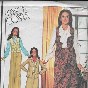 May include: Vintage McCall's pattern envelope featuring illustrations of women's fashion. The designs include a jacket, vest, skirt, and pants. The envelope has the text "MARIO'S CORNER" and "MISSES' AND JUNIOR UNLINED JACKET, VEST, SKIRT AND PANTS."