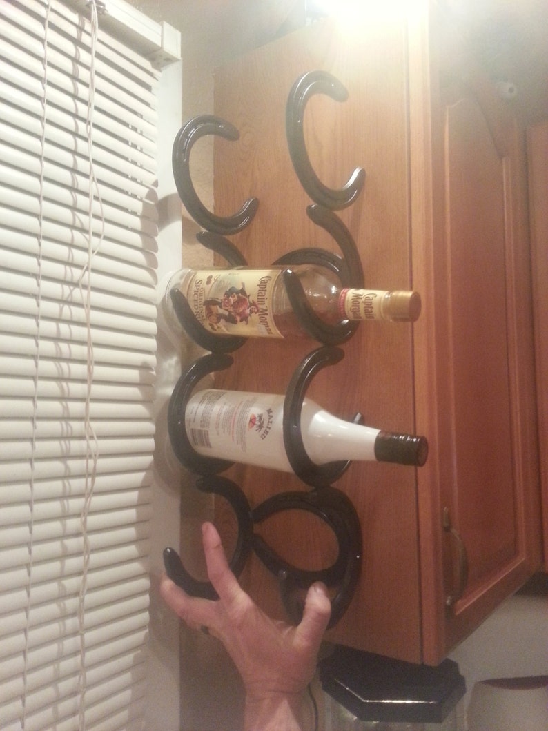 Horseshoe wine rack holds 5 bottles to go on side of Etsy