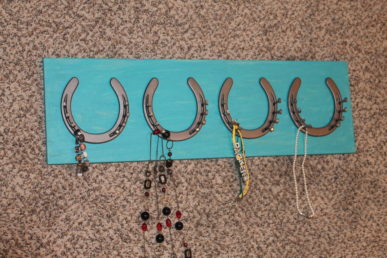 Horseshoe jewelry holder