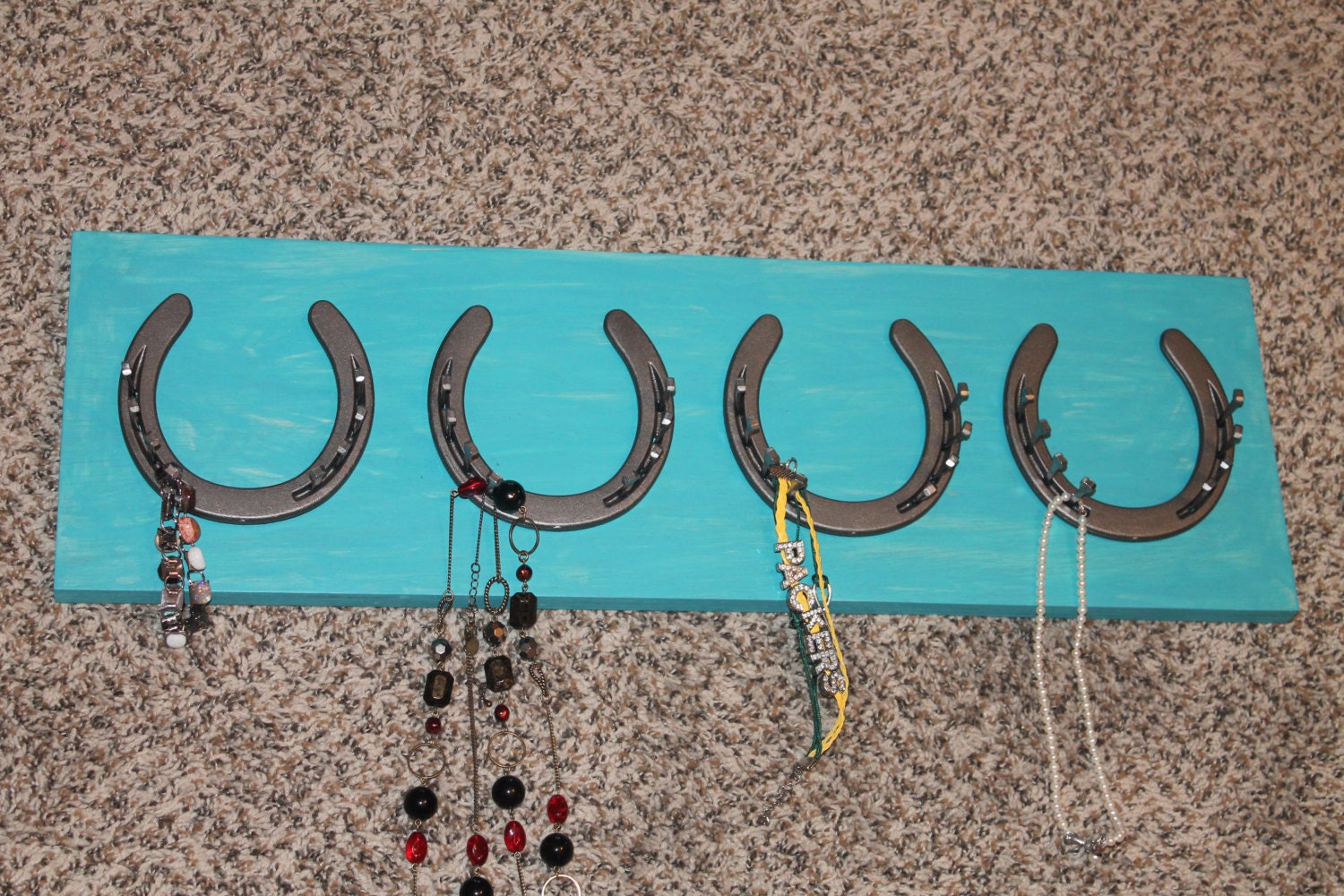 Horseshoe jewelry holder