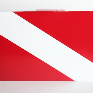 Diver down trailer hitch cover