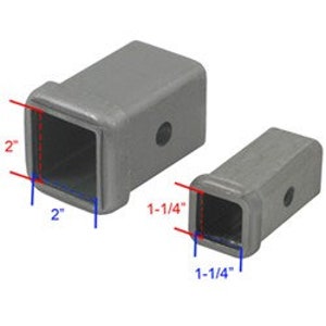 May include: Two silver metal trailer hitch receiver extension adapters. The larger adapter is 2 inches by 2 inches and the smaller adapter is 1-1/4 inches by 1-1/4 inches.