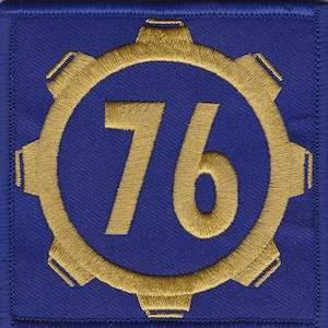 May include: A blue and gold embroidered patch with the number 76 inside a gear-shaped circle.
