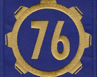 May include: A blue and gold embroidered patch with the number 76 inside a gear-shaped circle.