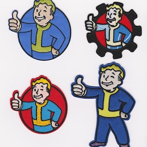May include: Four embroidered patches featuring a cartoon character with blonde hair, a blue jumpsuit, and a yellow belt. The character is giving a thumbs up. Three of the patches are circular with red or blue backgrounds. The fourth patch is a black gear with a red background.