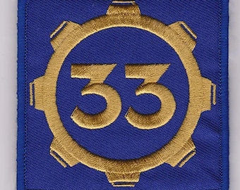 May include: A blue and gold embroidered patch with a gear design and the number 33 in the center.