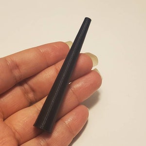 May include: A black, tapered, plastic cone-shaped object.