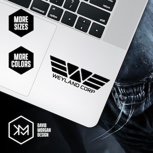 May include: A black and white Weyland Corp logo sticker on a laptop. The sticker is next to the text "MORE SIZES" and "MORE COLORS" in black hexagons. The image also includes the text "DAVID MORGAN DESIGN".