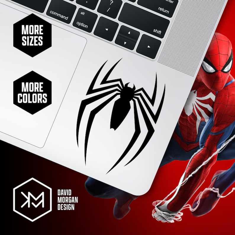 May include: A black spider logo sticker on a white laptop. The sticker is a stylized spider with long legs. The laptop is partially visible, with the keyboard and a corner of the screen. The image also includes the text "MORE SIZES" and "MORE COLORS".