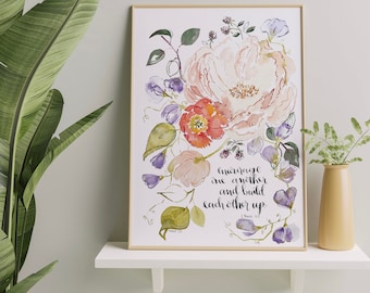 May include: A watercolor print with a floral design and the quote "Encourage one another and build each other up."  1 Thessalonians 5:11