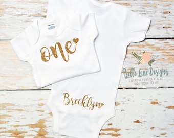 One with a Heart and Name On The Back, 1st Birthday Girl Bodysuit, First Bday Outfit, 12 18 24 Months, Short or Long Sleeve Gold Glitter 001