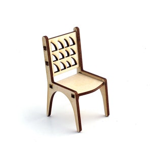 May include: A wooden chair with a unique, geometric back design. The chair is made of light wood and has a natural finish.