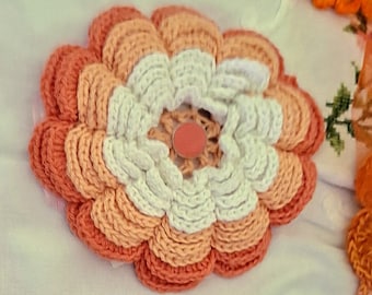 ORANGE---2 orange pot holders and 1 trivet in orange colors, crocheted, pot holders are cotton, the trivet is made from handspun kid mohair