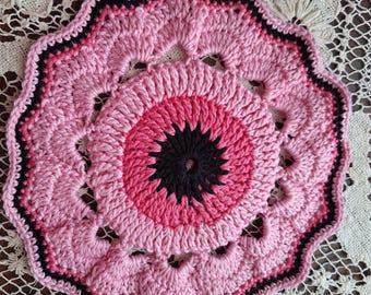 A cotton crocheted trivet and a knitted washcloth available as a set.  Both are made with cotton yarn. Handmade. Great gift. Available now!