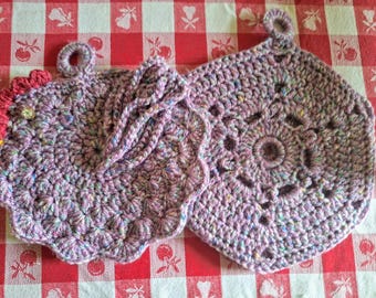 2 purple tweed potholders crocheted with acrylic yarn.  A chicken and one that has 6 sides.  The chicken has a comb, crop, beek end an eye.