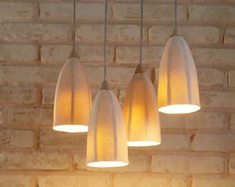 A Cluster of 4 unique Porcelain Pendant Lights. Contemporary lighting. White Hanging Shades for the Dining room.