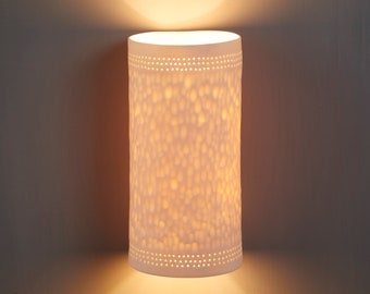 Glass cylinder 2024 wall sconce